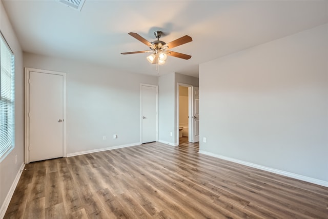 spare room featuring ceiling fan and hardwood / wood-style flooring