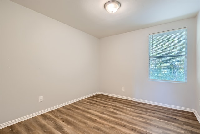 unfurnished room featuring wood-type flooring