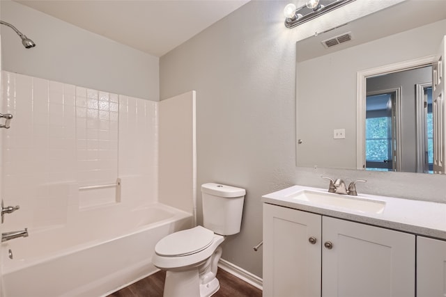 full bathroom featuring vanity, toilet, bathtub / shower combination, and hardwood / wood-style flooring