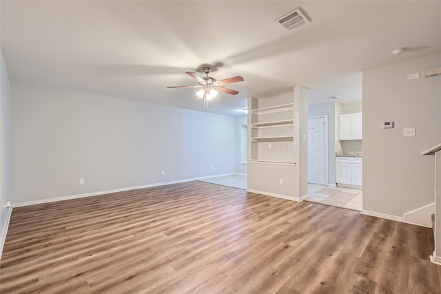 interior space featuring light hardwood / wood-style floors and ceiling fan