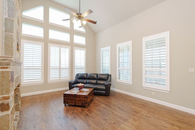 sitting room with a healthy amount of sunlight, ceiling fan, and hardwood / wood-style flooring