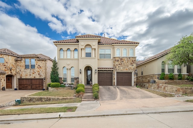 mediterranean / spanish home featuring a garage