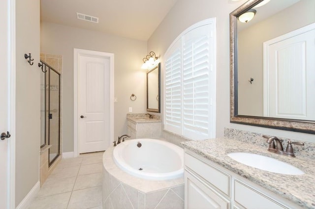 bathroom with tile patterned flooring, vanity, and plus walk in shower