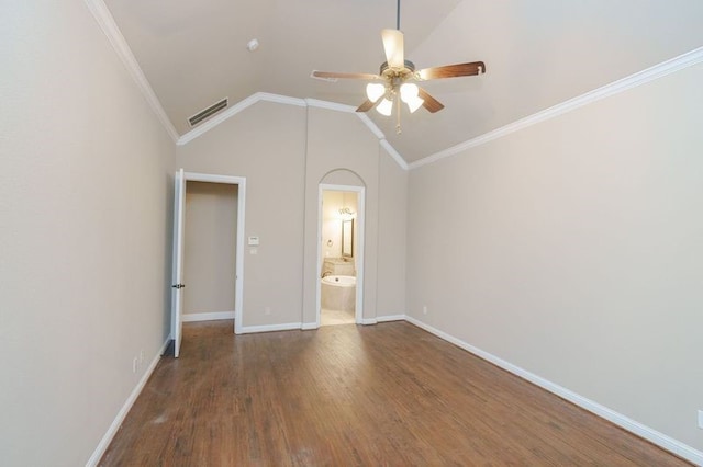 unfurnished bedroom with ornamental molding, dark hardwood / wood-style flooring, ceiling fan, and vaulted ceiling