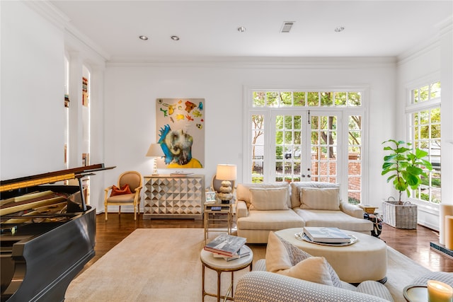 living room with ornamental molding, dark wood-type flooring, and french doors