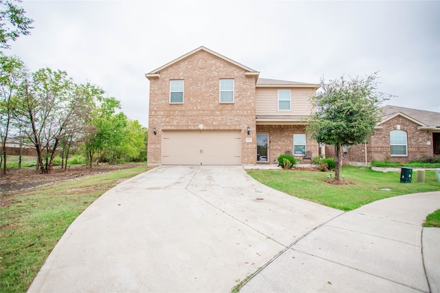 view of front of home with a front yard and a garage