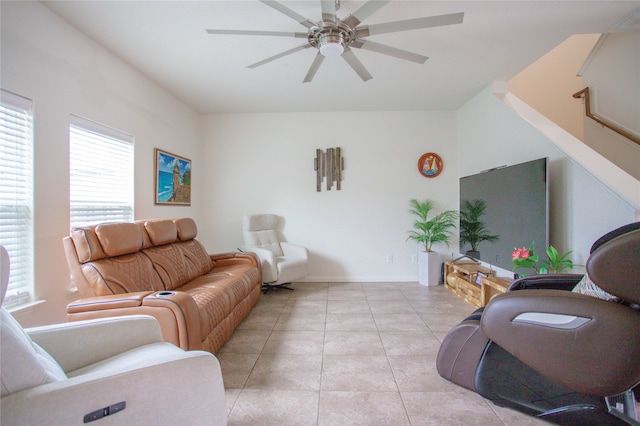 tiled living room with ceiling fan