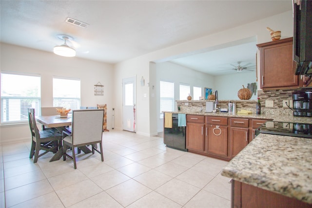 kitchen featuring decorative backsplash, light stone countertops, light tile patterned floors, dishwasher, and ceiling fan