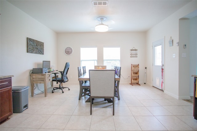 dining space featuring light tile patterned floors