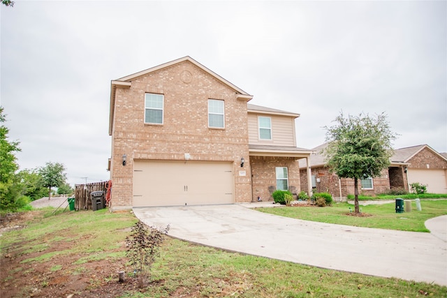 view of front of home featuring a front lawn and a garage