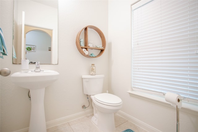 bathroom featuring tile patterned flooring and toilet