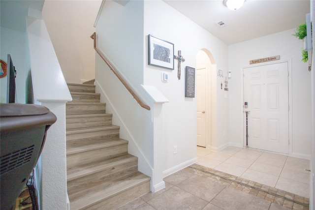 entrance foyer with light tile patterned floors