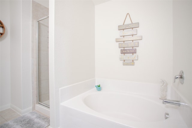 bathroom with plus walk in shower and tile patterned flooring