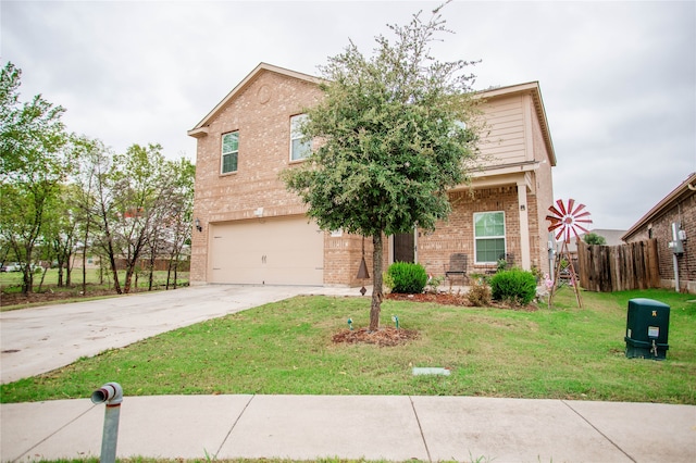 view of front of property featuring a garage and a front yard