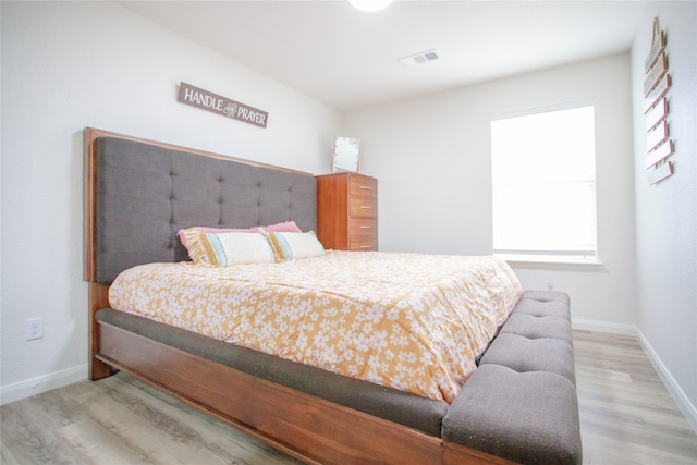 bedroom with light hardwood / wood-style flooring