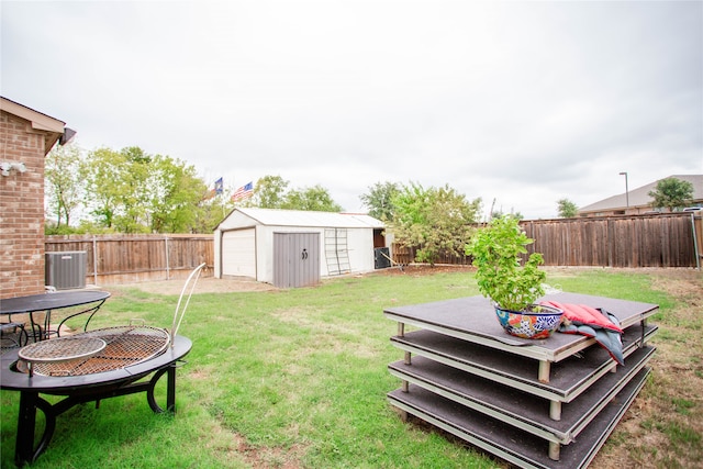 view of yard with a storage shed and cooling unit