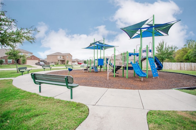 view of jungle gym featuring a lawn