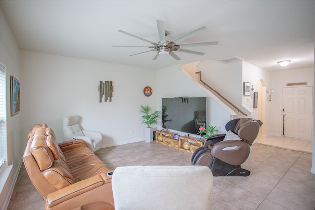 living room featuring ceiling fan and light tile patterned flooring