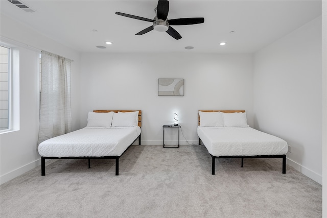 carpeted bedroom featuring ceiling fan