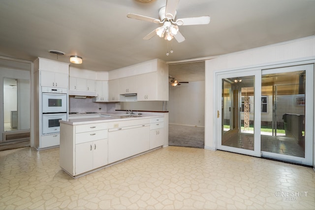 kitchen featuring white appliances, white cabinetry, ceiling fan, and sink