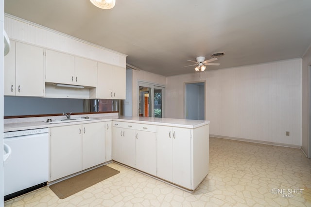 kitchen with ceiling fan, dishwasher, sink, kitchen peninsula, and white cabinets