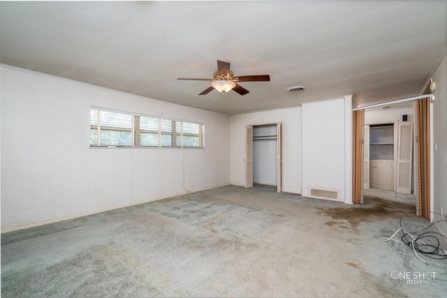 unfurnished bedroom featuring ceiling fan and light colored carpet