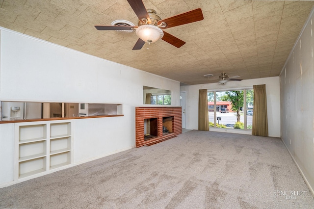 unfurnished living room with a fireplace, carpet, and built in features