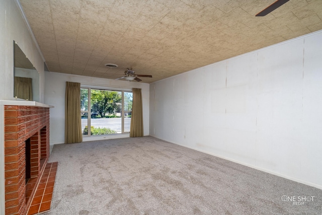 unfurnished living room with carpet flooring, ceiling fan, and a fireplace