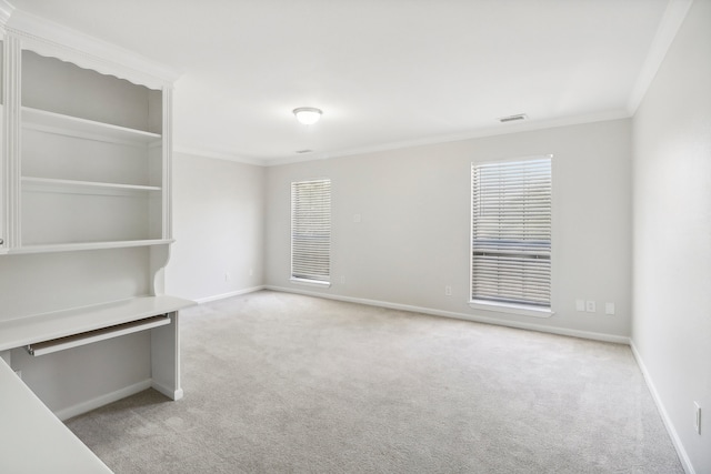 carpeted spare room with ornamental molding