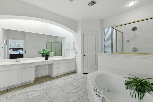 bathroom featuring vanity and separate shower and tub