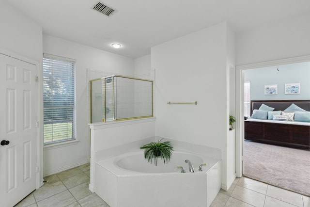 bathroom with plus walk in shower and tile patterned floors