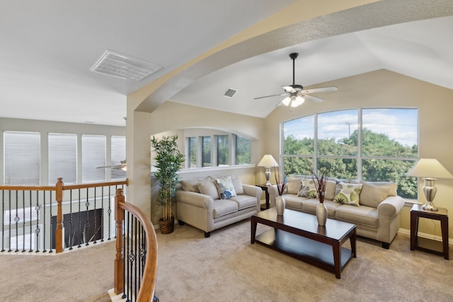 carpeted living room with lofted ceiling and ceiling fan