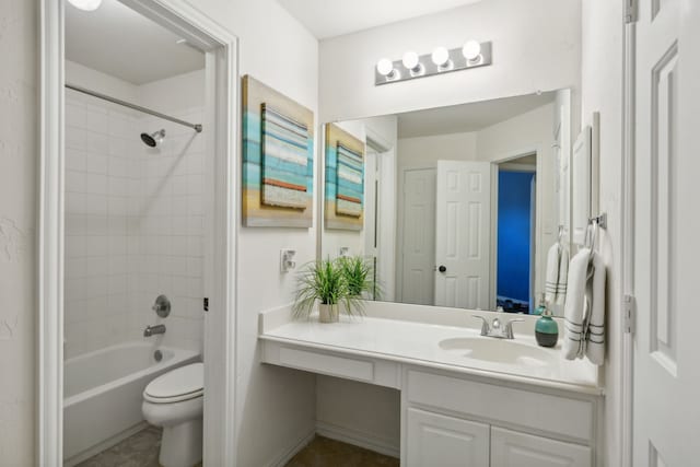 full bathroom with tiled shower / bath combo, vanity, and toilet