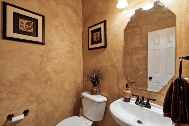 bathroom with toilet and sink