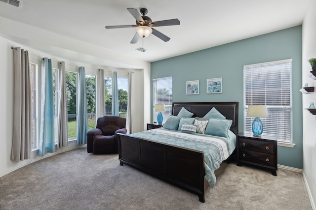 carpeted bedroom with ceiling fan