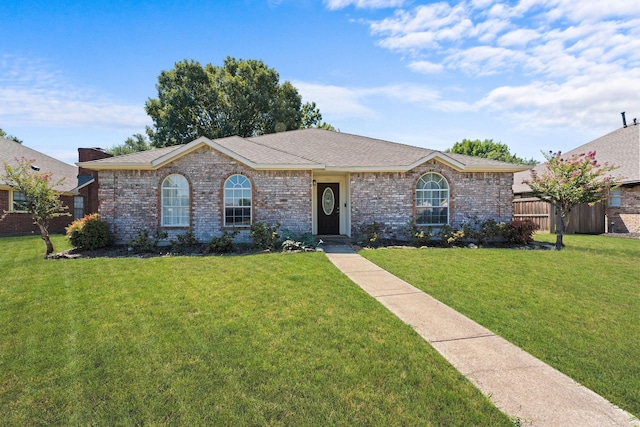 single story home featuring a front lawn