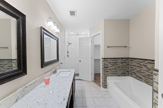 bathroom featuring vanity, separate shower and tub, and tile patterned floors