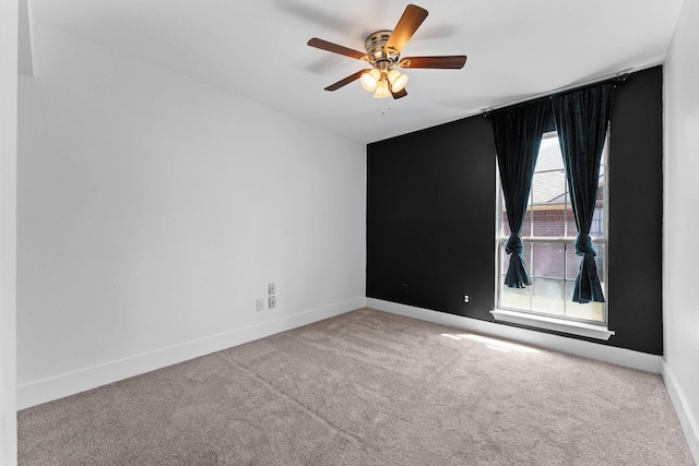 carpeted empty room with ceiling fan