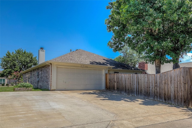 view of side of property featuring a garage