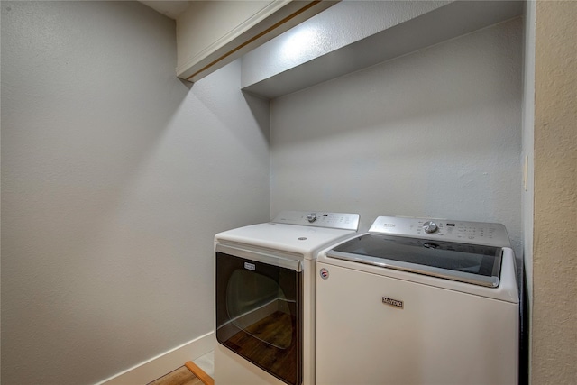 washroom with separate washer and dryer