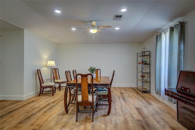 dining area with ceiling fan, light hardwood / wood-style floors, and a wealth of natural light