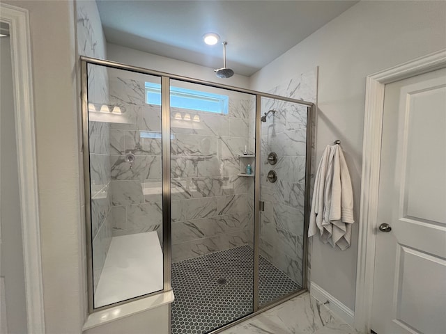 bathroom featuring a shower with shower door