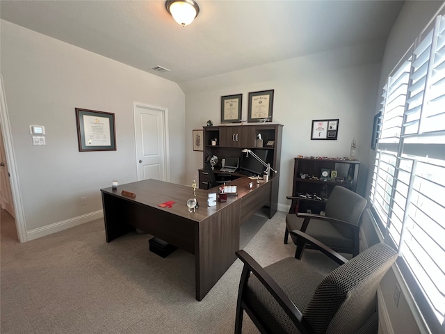 home office with light colored carpet