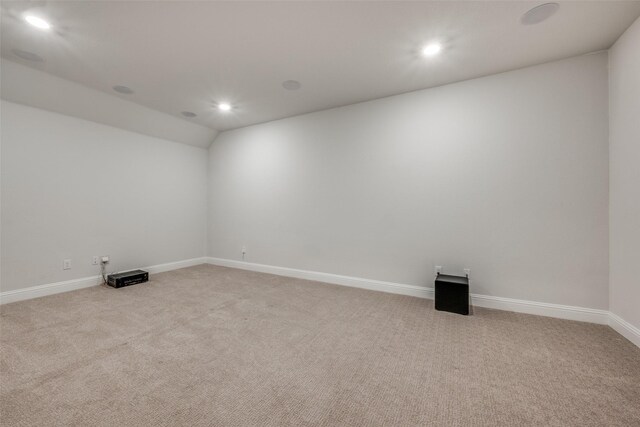 home theater featuring light carpet