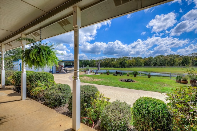 view of patio with a water view