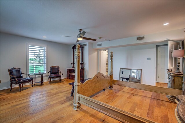 bedroom with ceiling fan and light hardwood / wood-style flooring