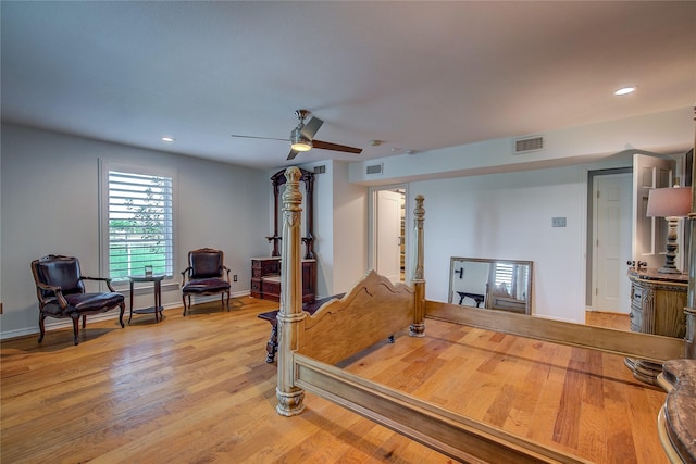 exercise room with baseboards, light wood-style flooring, visible vents, and recessed lighting