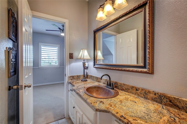 bathroom with vanity and baseboards