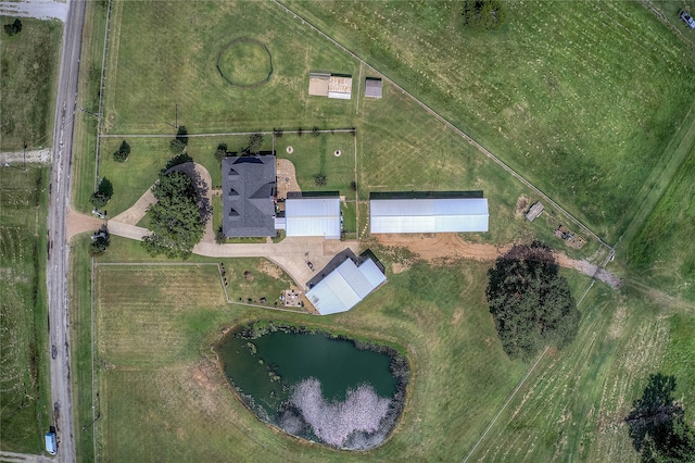 birds eye view of property with a water view and a rural view