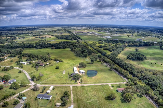 drone / aerial view featuring a water view and a rural view